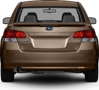 Rear view with tail lights, badge, spoiler, and exhaust pipe