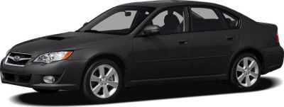 Front view of a sporty sedan with a hood scoop and alloy wheels