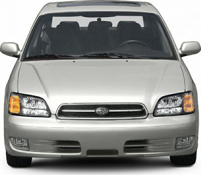 Front view with headlights, grille, and fog lights of a sedan.