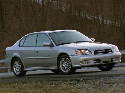 Silver sedan with alloy wheels and classic front grille.