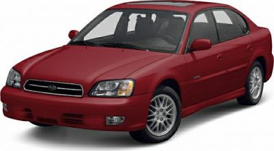 Red sedan with facelift front, alloy wheels, and clear headlights
