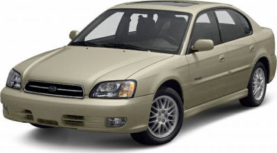 Front angle exterior view of a beige mid-size sedan with alloy wheels