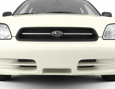 Close-up of front grille and headlights on white vehicle
