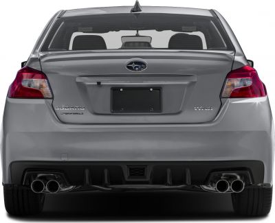 Rear view showing quad exhaust tips and integrated rear spoiler