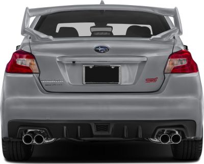 Rear view with prominent spoiler and quad exhaust tips