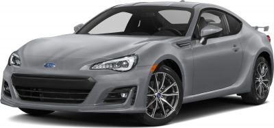 Aggressive headlights and sporty alloy wheels on a sleek coupe front
