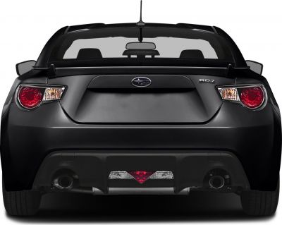Rear view of sports coupe with spoiler and dual exhaust