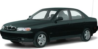 Compact four-door sedan with front side view and alloy wheels