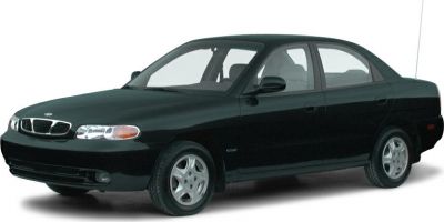 Compact sedan with classic 1990s styling, front side view
