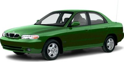 Green 1990s sedan showing front and side view