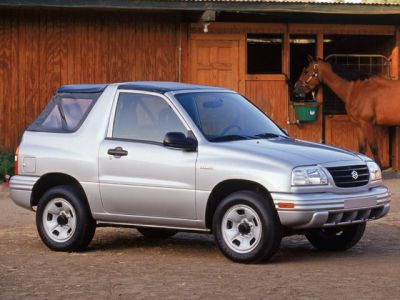 Silver compact SUV with two doors and rugged design shown from front-side angle