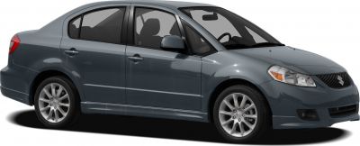 Side view of sedan with alloy wheels and front fog lights.