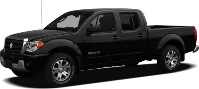 Black pickup truck with crew cab and long bed.