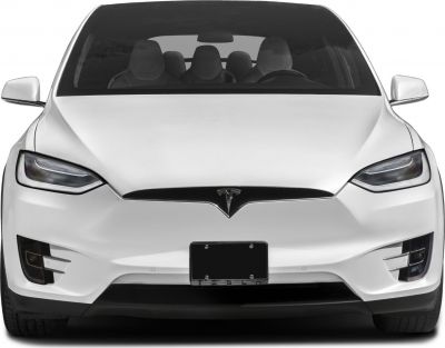 Front view with distinct Tesla headlights and sleek grille design