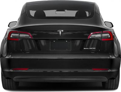 Rear view of Tesla Model 3 facelift with dual motor badge and modern tail lights.