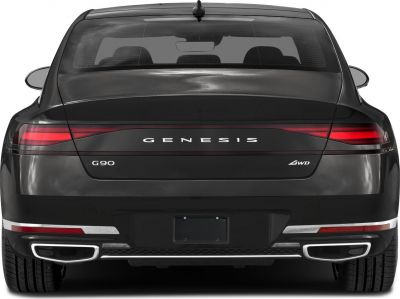 Sleek rear with LED tail lights and dual exhaust tips on a luxury sedan