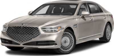 Luxury sedan front with large grille and intricate alloy wheels
