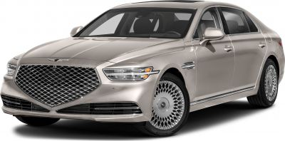 Large diamond-pattern grille and distinctive alloy wheels on sleek luxury sedan
