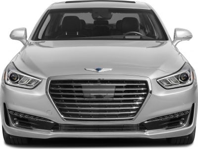 Prominent front grille and multi-element headlights of a luxury sedan