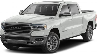 White pickup front-side view with grille, headlights, and alloy wheels