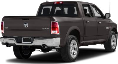 Rear and side view of 4x4 crew cab pickup with dual exhaust and chrome wheels