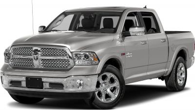 Chrome grille and alloy wheels visible on pickup truck front-side view