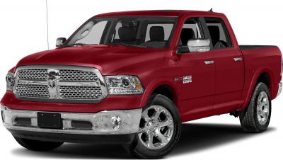 Front grill and chrome wheels of a pickup truck