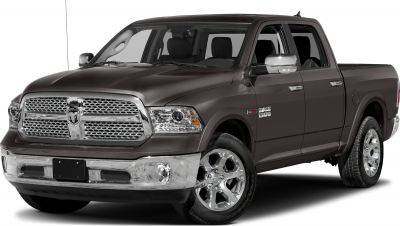 Front side view of a pickup with chrome grille and crew cab.