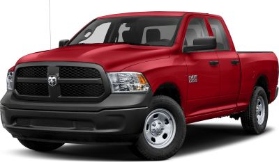 Red pickup with black grille and steel wheels from front-side perspective