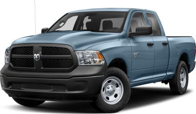 Front view of Quad Cab truck with black honeycomb grille and steel wheels