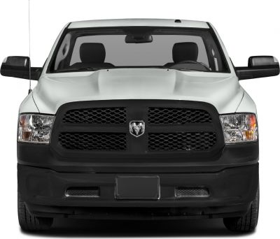 Front grille with emblem and dual headlights of pickup truck