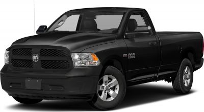 Black pickup with large front grille and alloy wheels
