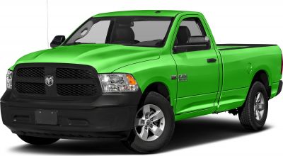 Front-side view of green pickup with black grille and silver wheels