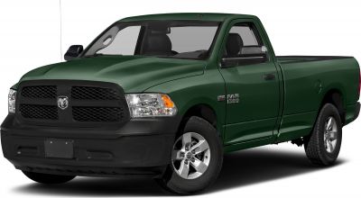 Front side view of a regular cab pickup truck with black grille and alloy wheels.