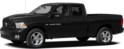 Black quad cab pickup with chrome wheels and detailed grille