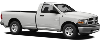 White pickup truck with regular cab and long bed, front side angle.