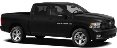 Side profile of black four-door pickup with long cargo bed