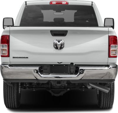Rear view with tailgate, RAM emblem, Bighorn badge, and chrome bumper