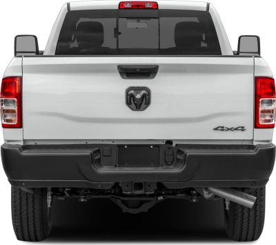 Rear view showing tailgate, dual tail lights, 4x4 badge, and bumper of a pickup truck