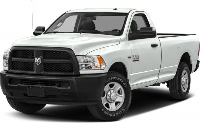 Front side view of pickup truck with bold grille and rugged tires