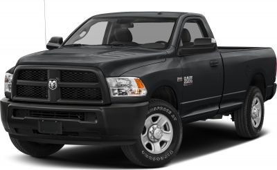 Front view of heavy-duty pickup with dual-bar grille and rugged tires