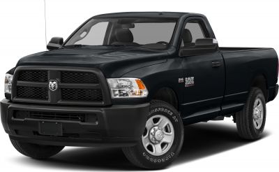 Front angled view of pickup's grille, headlights, and wheels