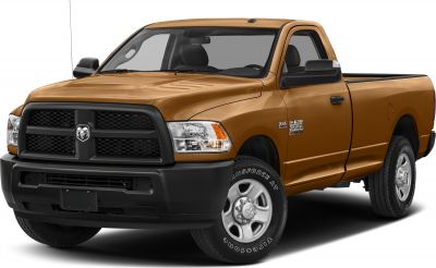 Front view of pickup truck with grille, headlights, and side mirror