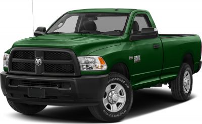 Green pickup truck with regular cab and black grille.