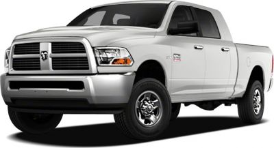 Front grille and body side view of a light-colored pickup truck
