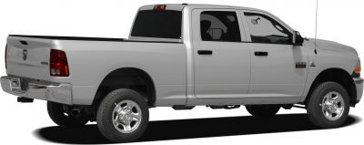 Side view of extended cab pickup with long bed and chrome wheels