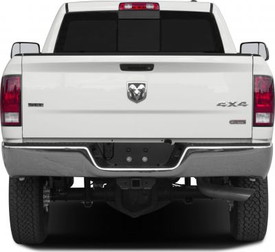 Rear view of a pickup with 4x4 and diesel badges, chrome bumper, and dual rear tires.