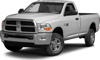 Front view of a heavy-duty regular cab pickup with prominent grille and off-road tires.