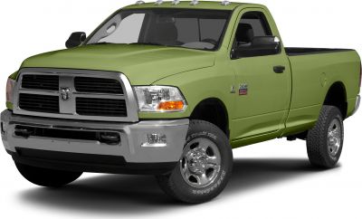 Front-side view of a heavy-duty regular cab pickup with chrome grille and rugged tires