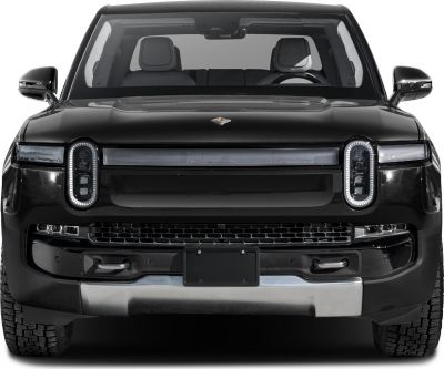 Close-up of unique LED headlights and front grille of a modern electric pickup